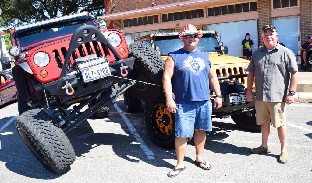 Austin Jeep People members Sharif Mezayek and Dennis Garrett show off their 4-wheel parking skills at their first G21 Car & Bike show. Both work for the Sheriff’s department and were happy to be part of the parade to raise money for Victims’ Assistance. Funds will go toward helping victims get back on their feet with bills or other types of sustenance and support. 