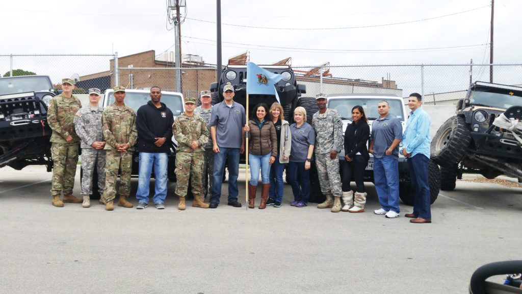 Share the Will volunteers prepare to make deliveries to Fort Hood families at last year's Project Christmas event. Gifts were delivered in a parade of Jeeps from the Austin Jeep People; known, as in the photo above, for their "creative" methods of parking. 