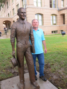 Sculptor Lucas Adams with his finished work. 