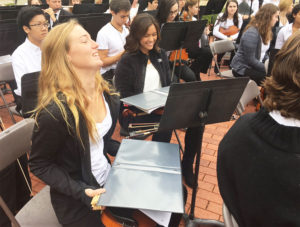 Members of the Georgetown High School orchestra keeping the rain off their instruments. The rain stopped just moments before 11am. 